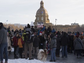 Anti-mask protestors during a rally at the Alberta legislature on Saturday, Feb. 20, 2021 in Edmonton.
