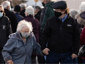 Hundreds of people with vaccination appointments queued outside of an Alberta Health Services clinic at Skyview Power Centre in Edmonton, on Thursday, Feb. 25, 2021.