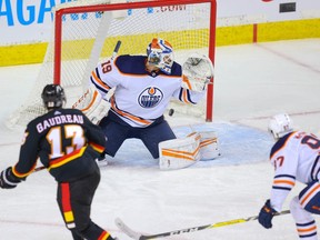 Calgary Flames Johnny Gaudreau scores on goalie Mikko Koskinen of the Edmonton Oilers during NHL hockey in Calgary on Saturday February 6, 2021.