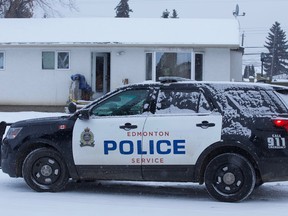 Police investigate a shooting at a home near 87 Avenue and 160 Street in west Edmonton on Thursday, Feb. 4, 2021.