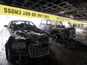 Two burned vehicles in the parkade of the Westpark Ridge apartments, 7715 159 St., in Edmonton, Alta. on Friday Feb. 5, 2021.