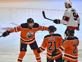 Edmonton Oilers Dominik Kahun (21) celebrates his goal with Leon Draisaitl (29) and Tyson Barrie (22) against the Ottawa Senators during NHL action at Rogers Place in Edmonton, January 31, 2021.