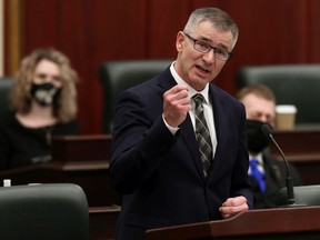 Minister of Finance Travis Toews delivers the 2021 Alberta Provincial budget at the Alberta Legislature, in Edmonton Thursday Feb. 25, 2021.