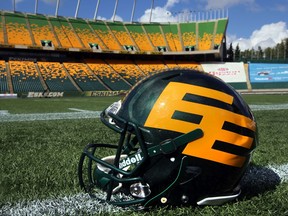 A new design helmet sits on the sidelines during the Edmonton Eskimos' practice at Commonwealth Stadium in Edmonton, Alberta. File photo.