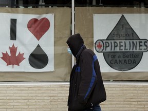 Oil, gas, pipeline, pipelines



A pedestrian wearing a protective face mask makes their way past pro-Canadian oil and pipelines posters near 99 Street and 76 Avenue, in Edmonton Tuesday Jan. 19, 2021. U.S. president-elect Joe Biden is expected to cancel the Keystone XL pipeline on his first day in office. Photo by David Bloom