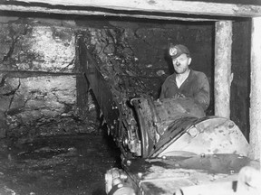 A miner operates an Anderson Boys Universal Coal Cutter in Galt No. 8 mine at Lethbridge. Credit: Sir Alexander Galt Museum and Archives.