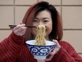 Catherine Lee-Hannley poses with a bowl of her Nai Nai Mie handcrafted noodles. Photo by David Bloom/Postmedia