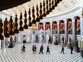 House impeachment managers process through Statuary Hall to present arguments in the Senate impeachment trial against former President Donald Trump at the U.S. Capitol in Washington, D.C., on Feb. 9, 2021.