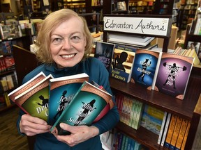 Local author Emma Pivato with her collection of mystery books she's written on display at Audreys Books in Edmonton, March 2, 2021.