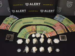 Two Edmonton men are facing charges after ALERT Grande Prairie seized 524 grams of cocaine, 137 oxycodone tablets, and $9,225 cash. Image supplied by ALERT