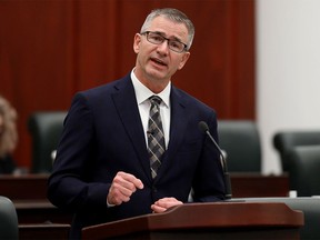 Alberta Finance Minister Travis Toews delivers the 2021 provincial budget at the Alberta legislature in Edmonton on Thursday, Feb. 25, 2021. Toews released a fiscal and economic update on Tuesday.