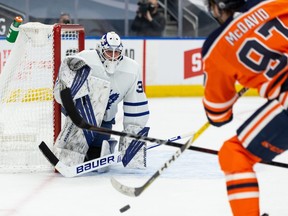 Edmonton Oilers Connor McDavid (97) shoots on Toronto Maple Leafs’ goaltender Michael Hutchinson (30) during first period NHL action at Rogers Place in Edmonton, on Monday, March 1, 2021.