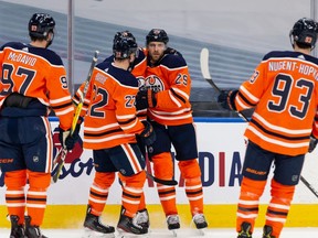 Edmonton Oilers’ Leon Draisaitl (29) celebrates a goal with teammates on Ottawa Senators’ goaltender Matt Murray (30) during first period NHL action at Rogers Place in Edmonton, on Wednesday, March 10, 2021.