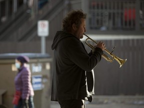 A trumpet player practices in a parkade near 108A Street and 86 Avenue, in Edmonton Tuesday March 16, 2021. Photo by David Bloom