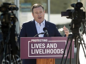 Premier Jason Kenney provides an update on the distribution of COVID-19 vaccines through participating community pharmacies, during a press conference outside a Shoppers Drug Mart, 5970 Mullen Way, in Edmonton Thursday March 18, 2021. Photo by David Bloom