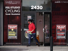 A man leaves the GoodLife Fitness facility in southwest Edmonton on Tuesday, March 2, 2021.
