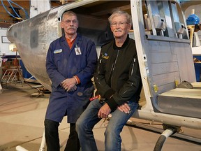 Taking a break from working on the 206A helicopter being restored at the Alberta Aviation Museum, are Harry Nagel, left, lead restoration volunteer and former aviation technician with the CFB-based 408 Helicopter Squadron, and John Liddle, the restoration project manager, a retired RCAF technician.