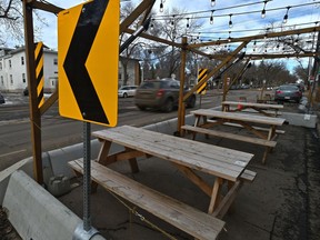 As the weather gets warmer into spring patios will be returning soon being shared with roadways like this one along 121 St. in Edmonton, March 7, 2021.