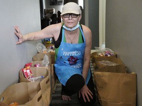 Georgette Popoff with bags of food at her northeast Edmonton home on Sunday March 14, 2021.