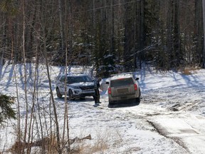 Wood Buffalo RCMP secure a trail, located near Silin Forest Road and Thicket Drive, on Sunday, March 21, 2021 after human remains were found in the area.