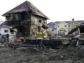 Fire investigators were on scene at a fire that started at a house under construction at 11512 82 St. and spread to a neighbouring structure on Friday morning, March 26, 2021.