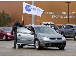 Members of the Non-Academic Staff Association (NASA), Association of Academic Staff of the University of Alberta (AASUA), students and other supporters hold a car caravan protest against post-secondary education cuts on Saturday, March 27, 2021, in Edmonton.