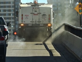 Spring must be in the air with the sand sweepers cleaning the streets in downtown Edmonton, March 30, 2021. Ed Kaiser/Postmedia