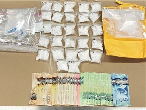 Red Deer RCMP have arrested and charged a man with drug trafficking after police seized a quantity of methamphetamine, cocaine and cash from various locations in Sylvan Lake. (Supplied photos/RCMP)