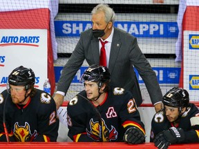Calgary Flames head coach Darryl Sutter on the bench during a game against the Montreal Canadiens during NHL hockey in Calgary on Thursday March 11, 2021.