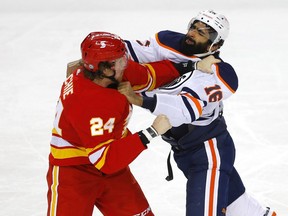 Calgary Flames Brett Ritchie fights Edmonton Oilers Jujhar Khaira in first period NHL action at the Scotiabank Saddledome in Calgary on Monday, March 15, 2021.