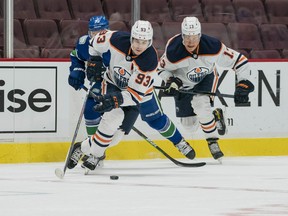 Edmonton Oilers forward Ryan Nugent-Hopkins (93) skates against the Vancouver Canucks iat Rogers Arena on Saturday, March 13, 2021.