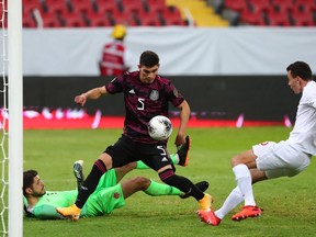 Mexico's Johan Vasquez scores against Canada at the CONCACAF Men's Olympic Qualifying tournament in Jalisco, Guadalajara, Mexico on March 28, 2021.