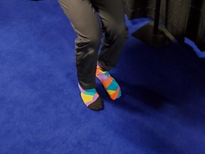 Alberta skip Brendan Bottcher shows off his long colourful socks at the 2021 Tim Hortons Brier in Calgary.