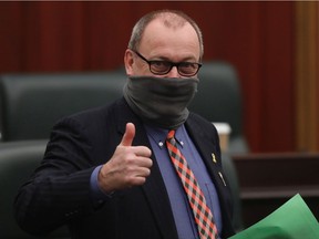 Minister of Transportation and Municipal Affairs Ric McIver arrives for the presentation of the 2021 Alberta Provincial budget at the Alberta Legislature, in Edmonton Thursday Feb. 25, 2021.