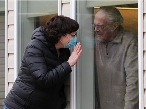 Linda Tymchuk visits with her father Don Brown