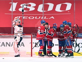 Montreal Canadiens left wing Artturi Lehkonen (62) celebrates his goal against Edmonton Oilers goaltender Mikko Koskinen (19) with teammates during the first period at Bell Centre on Mar. 30, 2021.