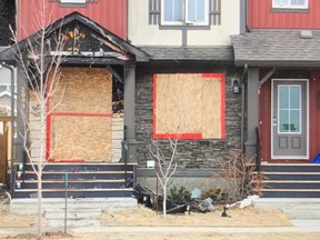 The end unit of a duplex caught boarded up Wednesday March 31, 2021 after a fire the evening prior. Investigators say the fire was caused by an unattended barbecue.