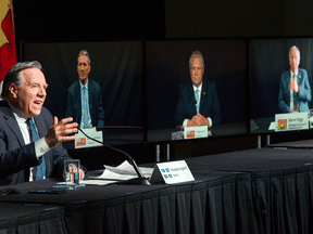 Quebec Premier Francois Legault chairs a premiers virtual news conference as premiers Brian Pallister, Manitoba, Doug Ford, Ontario and Blaine Higgs, New Brunswick are seen on screen, Thursday, March 4, 2021 in Montreal.