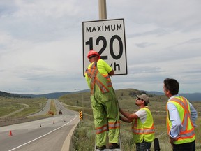 KAMLOOPS, BC: July 2, 2014  B.C. transportation ministry crews change the speed limit signs as the province changes the new maximum speeds on some 1,300 kilometres of rural highways. File photo.