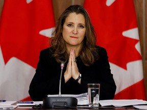 FILE PHOTO: Canada's Deputy Prime Minister and Minister of Finance Chrystia Freeland speaks to news media before unveiling her first fiscal update, the Fall Economic Statement 2020, in Ottawa, Ontario, Canada November 30, 2020.