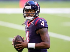 HOUSTON, TEXAS - JANUARY 03: Deshaun Watson #4 of the Houston Texans participates in warmups prior to a game against the Tennessee Titans at NRG Stadium on January 03, 2021 in Houston, Texas.