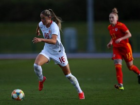 Janine Beckie of Canada runs with the ball during the Women's International Friendly match between Wales and Canada at Leckwith Stadium on April 09, 2021 in Cardiff, Wales.
