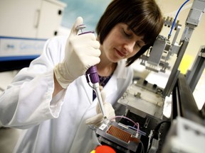 A GenCell employee works on a microfluid sample at their headquarters in Limerick, Ireland. File photo.