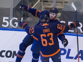 Edmonton Oilers Leon Draisaitl (29) celebrates his goal against the Winnipeg Jets with Tyler Ennis (63) during first period NHL action on Wednesday, Feb. 17, 2021 in Edmonton.