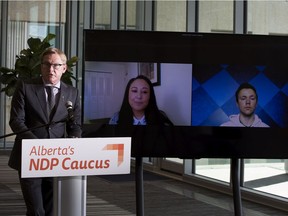 Alberta NDP advanced education critic David Eggen joins students Anita Cardinal-Stewart, left, a second year law student and Andrew Batycki, a third-year environmental engineering student at the U of A on Tuesday, April 13, 2021, to call on the UCP to stop massive tuition hikes, upwards of 104 per cent in some programs.