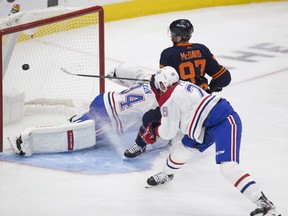 Edmonton Oilers Connor McDavid (97) scores on  Montreal Canadiens goalie Jake Allen (34) while Jeff Petry (26) watches during second period NHL action on Wednesday,April 21, 2021 in Edmonton.