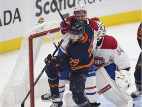 Edmonton Oilers Leon Draisaitl (29) battles with Montreal Canadiens Shea Weber (6) in front of goalie Jake Allen (34) during second period NHL action on Wednesday,April 21, 2021 in Edmonton.