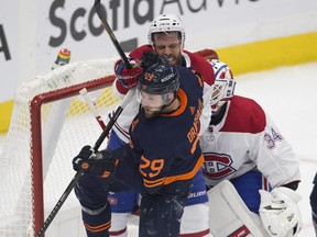 Edmonton Oilers Leon Draisaitl (29) battles with Montreal Canadiens Shea Weber (6) in front of goalie Jake Allen (34) during second period NHL action on Wednesday,April 21, 2021 in Edmonton.