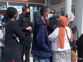 The family of 14-year-old Pazo and community advocates are calling on city police to launch a full investigation and lay charges after a schoolyard attack left him in hospital. Pazo is in the middle with the blue hoody.