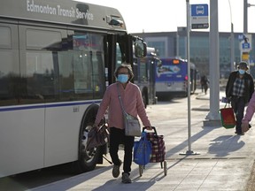 Transit riders at Edmonton Transit System's Mill Woods Transit Centre on Monday April 26, 2021. The city revamped the entire transit system on Sunday April 25, 2021.